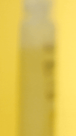 Load image into Gallery viewer, Lieve Care luxury lemon lime body wash in a clear bottle with a bright yellow background
